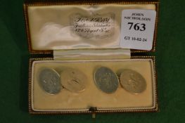 A pair of 9 carat gold oval cufflinks engraved with the initials A & H.