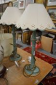 A pair of turned wood and painted table lamps.
