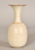 A studio pottery vase with speckled glaze, impressed signature stamp, 7