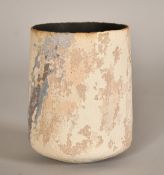A studio pottery vase with ribbed charcoal interior and a textured finish to the exterior, 5.25