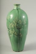A CHINESE GREEN GLAZED DRAGON VASE. 32.5cms high.