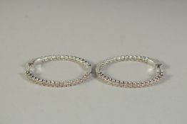 A PAIR OF WHITE GOLD AND DIAMOND HOOP EARRINGS.
