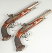 A PAIR OF PERCUSSION CAP PISTOLS, OCTAGONAL BARRELS, MAHOGANY STOCK with silver butt, both with