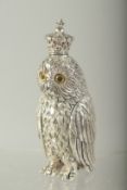 A SILVER PLATE OWL PERFUME BOTTLE. 9cms long.