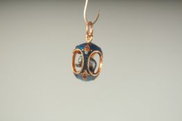 A RUSSIAN SILVER AND BLUE ENAMEL ELEPHANT PENDANT.