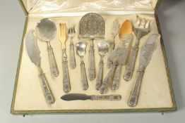 F. HUVELLIEZ A SUPERB SET OF TWELVE SILVER DESSERT KNIVES AND FORKS in a fitted leather case.
