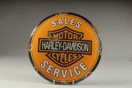 A HARLEY DAVIDSON ENAMEL SIGN. 11ins diameter.