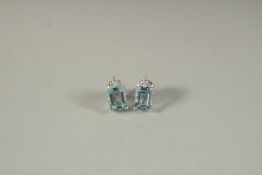 A PAIR OF 18CT WHITE GOLD, DIAMOND AND AQUAMARINE EAR STUDS.