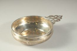 A GORHAM STERLING SILVER QUAICH. 4.25ins diameter. with a pierced handle.