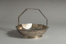 A TIFFANY & CO STERLING SILVER OCTAGONAL BASKET with swing handle. 7ins diameter. Weight 12ozs.