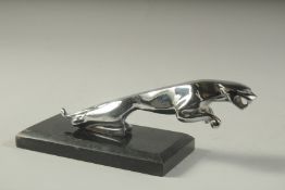 A CHROME JAGUAR MASCOT on a marble base.