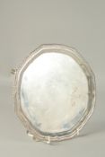 A SILVER PIE CRUST SALVER with gadrooned edge, on four pad feet, 8ins diameter. Birmingham, 1912.