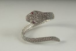 A SILVER MARCASITE RUBY EYE SNAKE BRACELET, boxed.