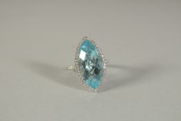 A GOOD 18CT WHITE GOLD, DIAMOND AND BLUE TOPAZ MARQUISE CUT RING.