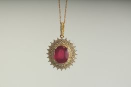A SILVER RUBY SET GOLD PLATED PENDANT AND CHAIN, boxed.