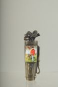 A BRASS AND ENAMEL GOLF BAG VESTA. 8cms long.