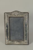 A SILVER PHOTOGRAPH FRAME with ribbons motif. 7.5ins x 5.5ins. London 1968.