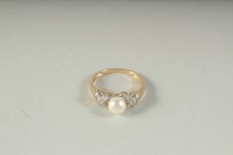 A 9CT GOLD PEARL AND DIAMOND RING, boxed.