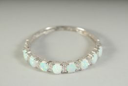 A GOOD SILVER OPAL SET BANGLE, boxed.