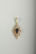 A 9CT GOLD GARNET PENDANT, boxed.