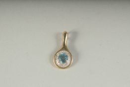 A GOOD 9CT GOLD BLUE TOPAZ AND DIAMOND PENDANT, boxed.