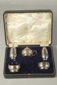 A FIVE PIECE SILVER CONDIMENT SET, cased. Chester 1910.