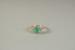 AN 18CT YELLOW GOLD, DIAMOND, EMERALD OCTAGONAL SHAPE CLUSTER RING.