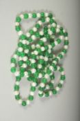 A STRING OF PEARLS AND JADE. 48ins long.