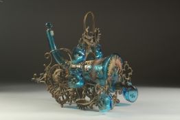 A GOOD CIRCA 1900 FRENCH GILT METAL CORNUCOPIA DESIGN GLASS WINE DECANTER with six glass cups. 11ins