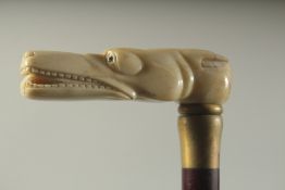 A WALKING STICK WITH CARVED BONE HANDLE 