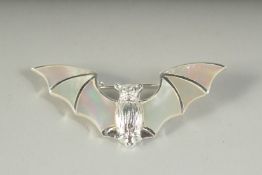 A SILVER AND MOTHER-OF-PEARL BAT BROOCH, boxed.