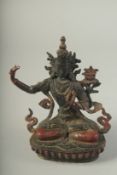 A BRONZE SEATED GUANYIN. 7ins high.