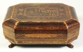 A CHINOSERIE BLACK AND GILT LACQUER GAMING BOX, containing lidded compartments and trays with mother