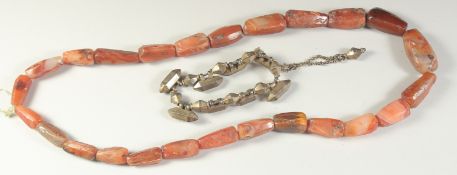 A POSSIBLY ANCIENT AGATE BEADED NECKLACE, along with a Mughal Indian gilt metal bracelet, with