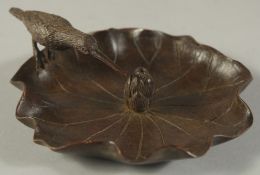 A BRONZE OKIMONO OF BIRD ON A LOTUS LEAF, 11.5cm wide.