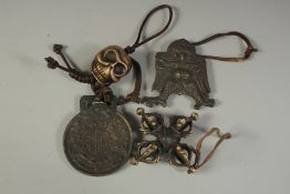 A COLLECTION OF FOUR TIBETAN BRASS TRINKETS, (4).