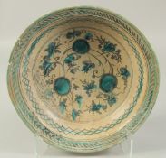 A LARGE 14TH-15TH CENTURY PERSIAN TIMURID GLAZED POTTERY CHARGER, 35cm diameter.