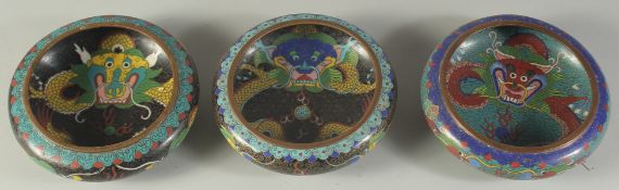 THREE CHINESE CLOISONNE DRAGON BOWLS, each approx. 14cm diameter, (3).