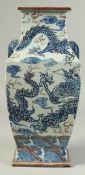 A CHINESE BLUE, WHITE AND UNDERGLAZE RED PORCELAIN SQUARE FORM DRAGON VASE, with moulded twin