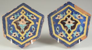 A PAIR OF 15TH CENTURY PERSIAN OR CENTRAL ASIAN TIMURID GLAZED POTTERY TILES, 18.5cm at widest