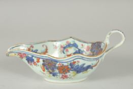 A FAMILLE ROSE PORCELAIN SAUCE BOAT, with gilt highlights, (af), 21cm long.