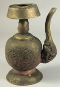 A TIBETAN EMBOSSED AND CHASED BRASS RITUAL EWER, 25.5cm high.