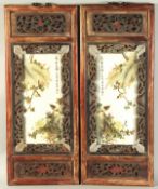 A PAIR OF CHINESE REPUBLIC PORCELAIN ENAMELLED PANELS, inset within wooden frames.