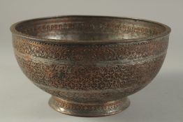 A FINE EARLY 19TH CENTURY NORTH INDIAN MUGHAL ENGRAVED TINNED COPPER BOWL, with Arabesque floral