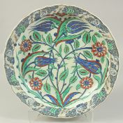 A LARGE 19TH CENTURY FRENCH IZNIK STYLE PORCELAIN DISH, painted with flora in red, blue, and
