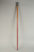 A WOODEN WALKING STICK WITH INDIAN BIDRI SILVER INLAID KNOB, 89cm long.