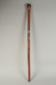 A CHINESE BAMBOO WALKING STICK, carved with snake, 89cm long.