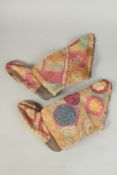 A PAIR OF 19TH CENTURY CENTRAL ASIAN SUZANI TYPE EMBROIDERED LEATHER BOOTS.