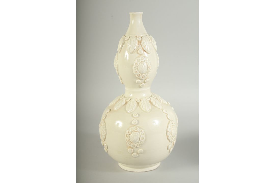 A CHINESE DING STYLE WHITE GLAZED DOUBLE GOURD VASE, with moulded decoration, 29cm high. - Image 9 of 11