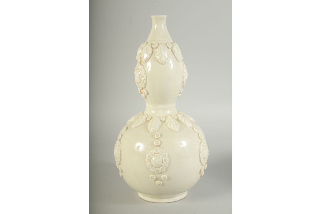 A CHINESE DING STYLE WHITE GLAZED DOUBLE GOURD VASE, with moulded decoration, 29cm high. - Image 7 of 11